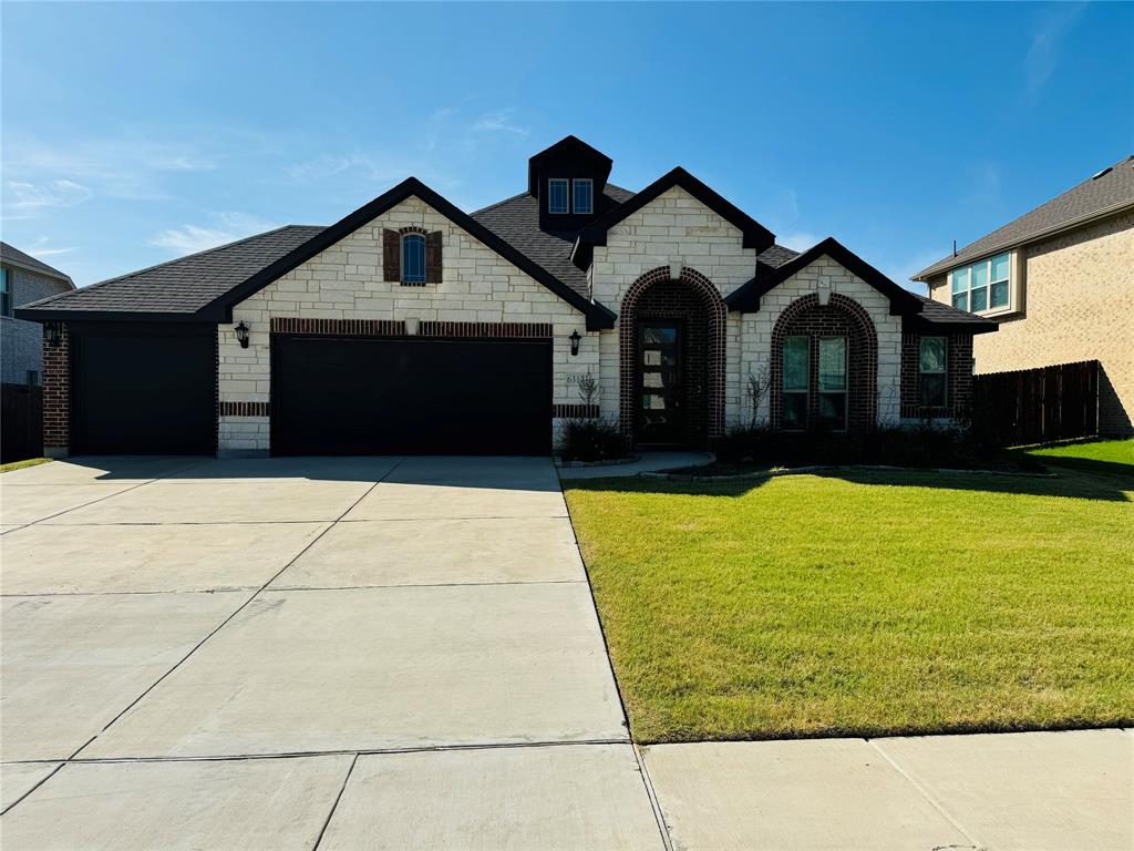 a front view of a house with yard