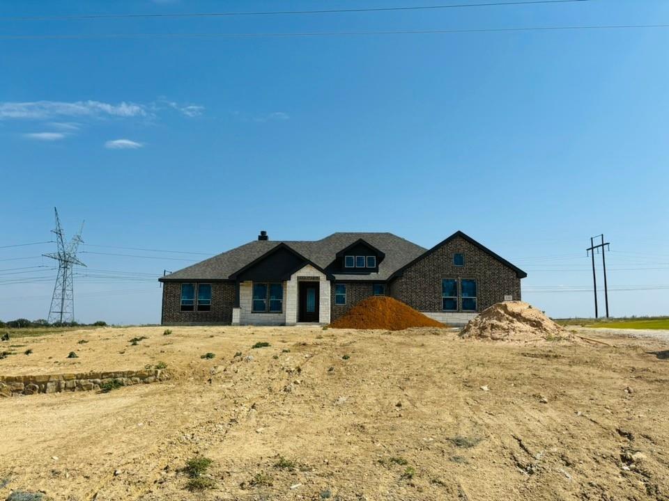 a view of front of house with a yard