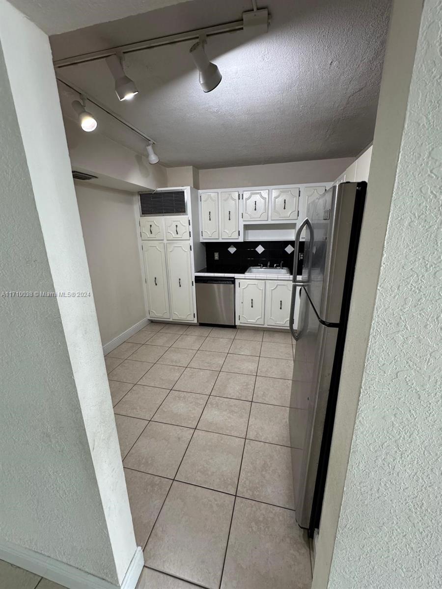 a view of an empty room with a fireplace