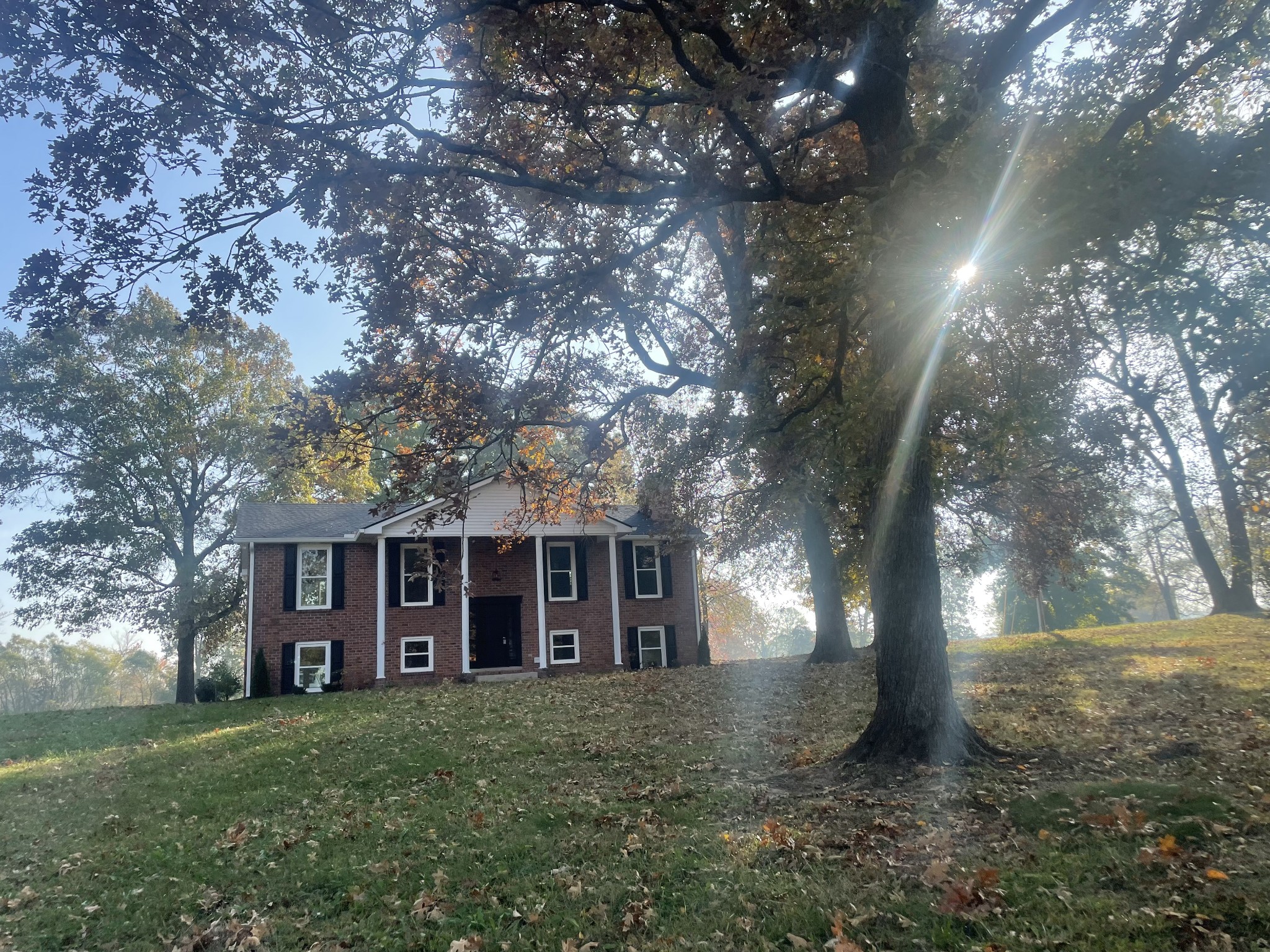 a view of a house with a yard