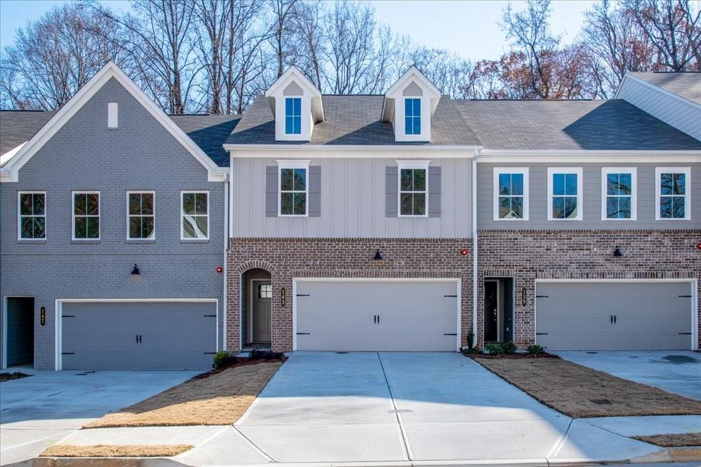 a front view of a house with a garage