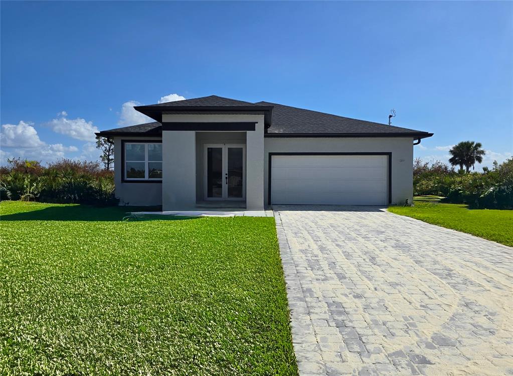 a front view of a house with garden