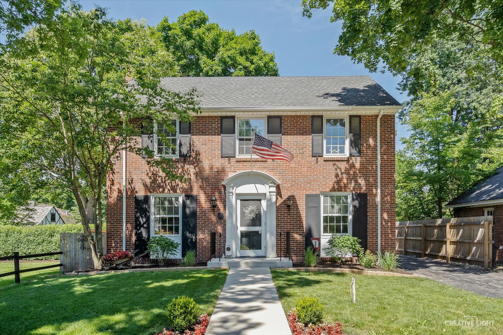 front view of a house with a yard