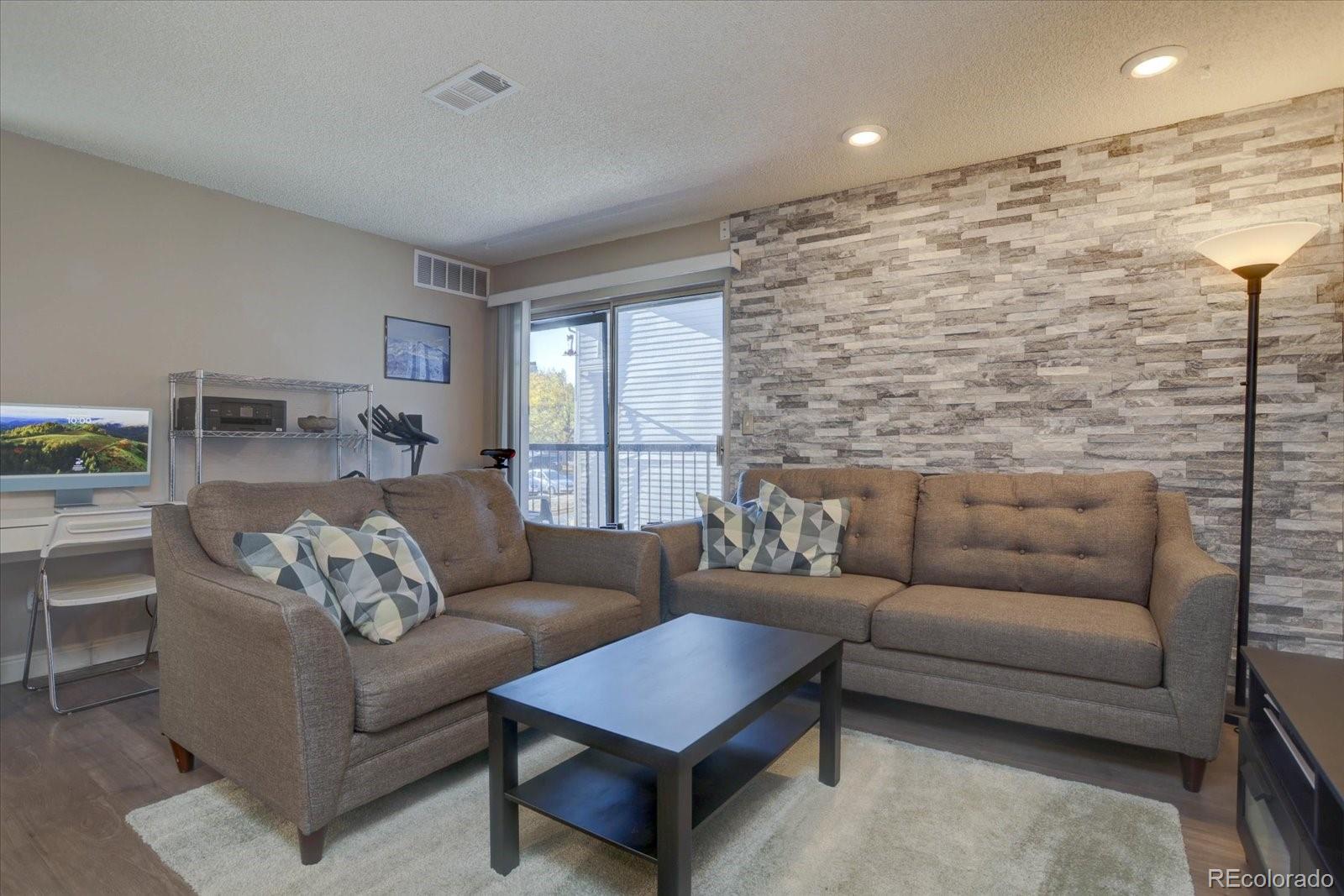 a living room with furniture and a couch