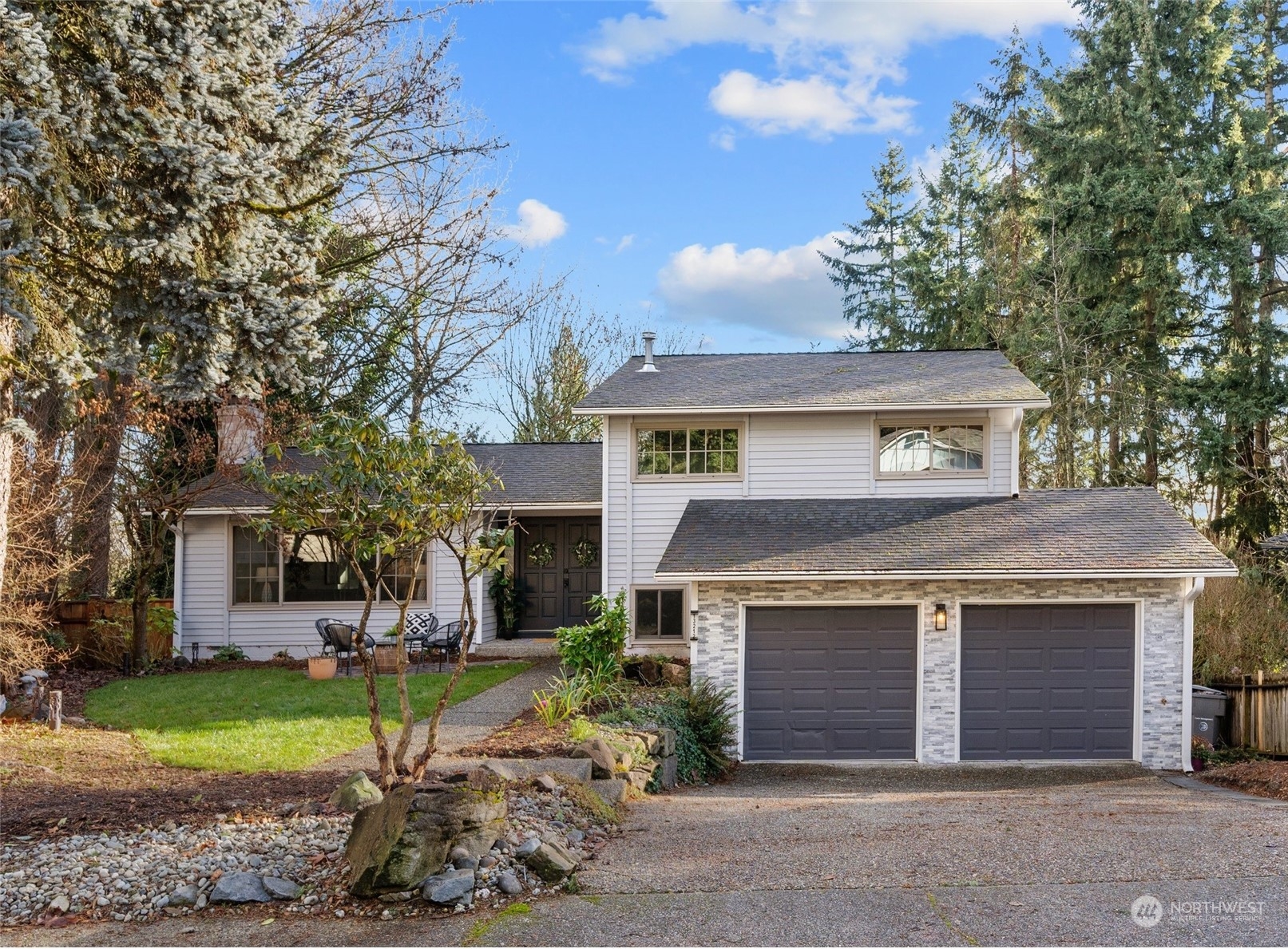 front view of a house with a yard