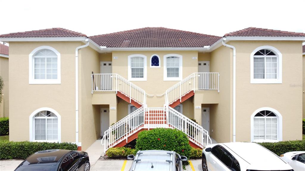 a front view of a house with parking