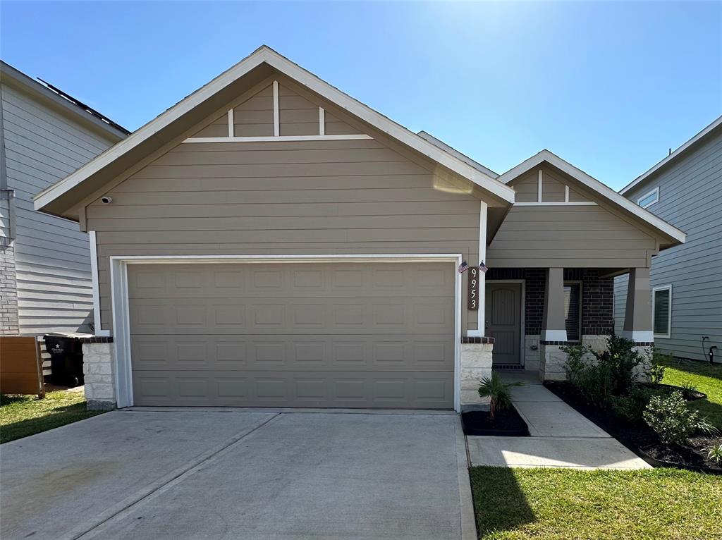 a front view of house with garage and yard