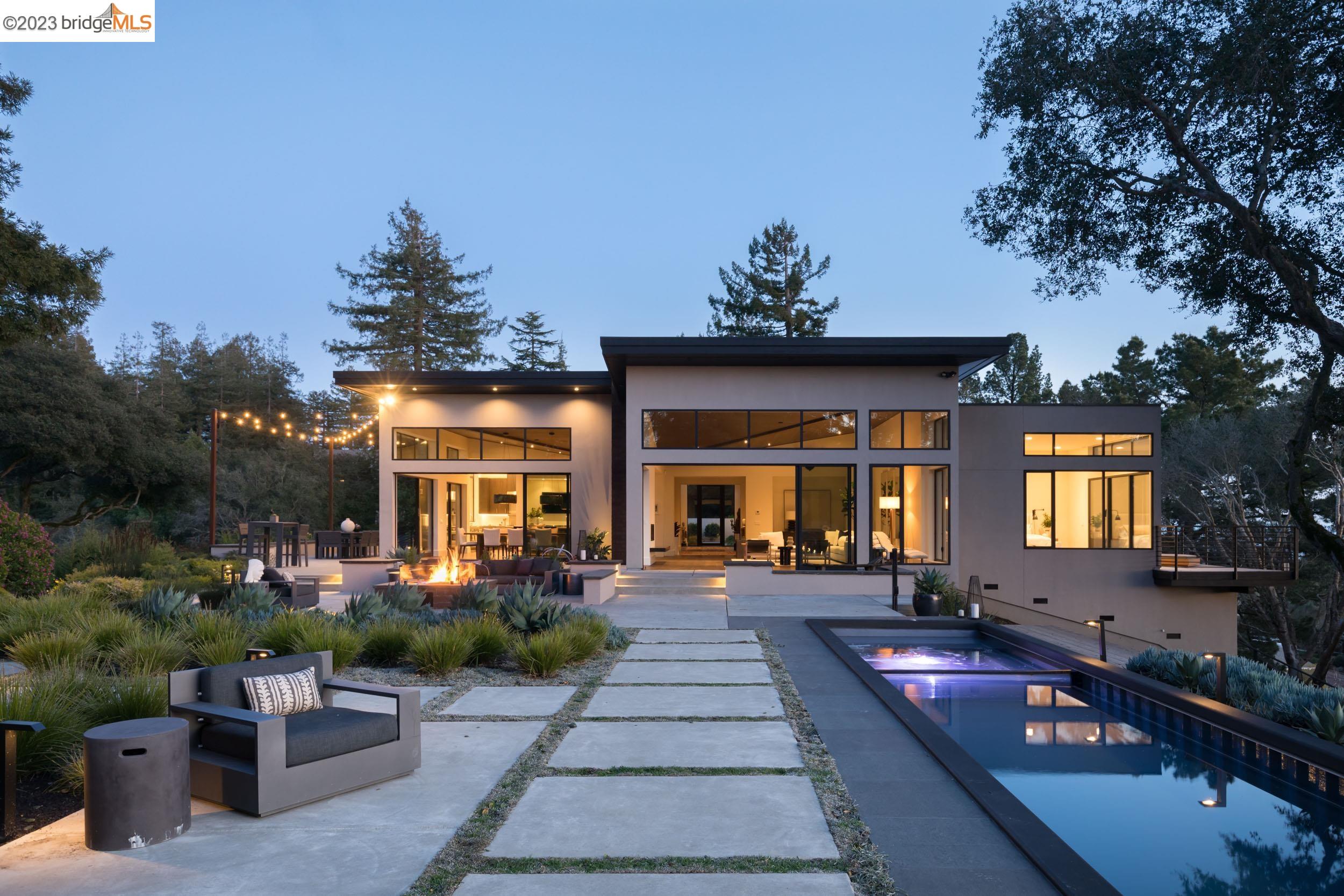 a front view of a house with outdoor seating