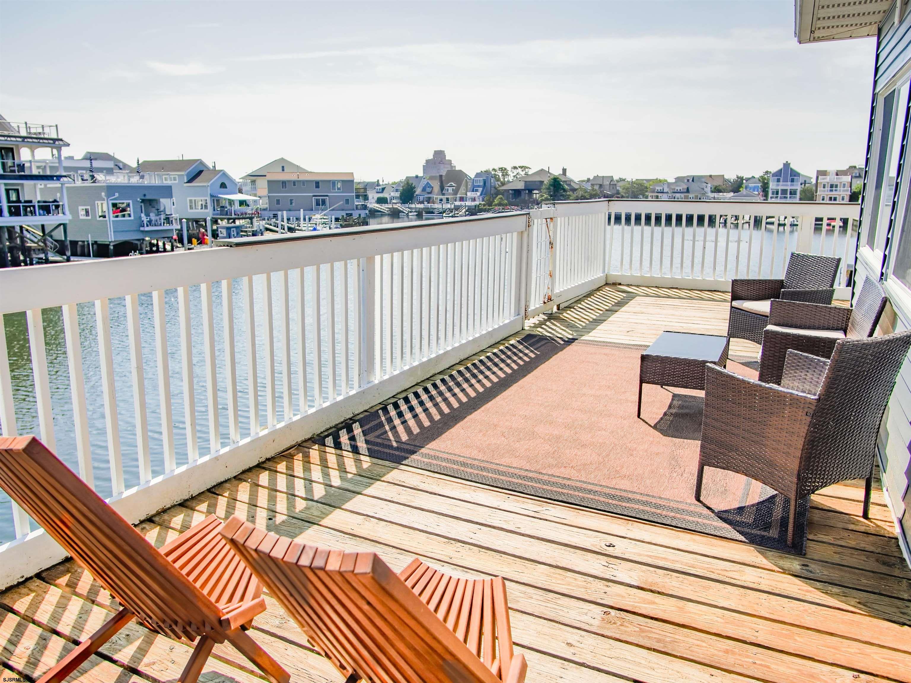 a view of a terrace with wooden floor