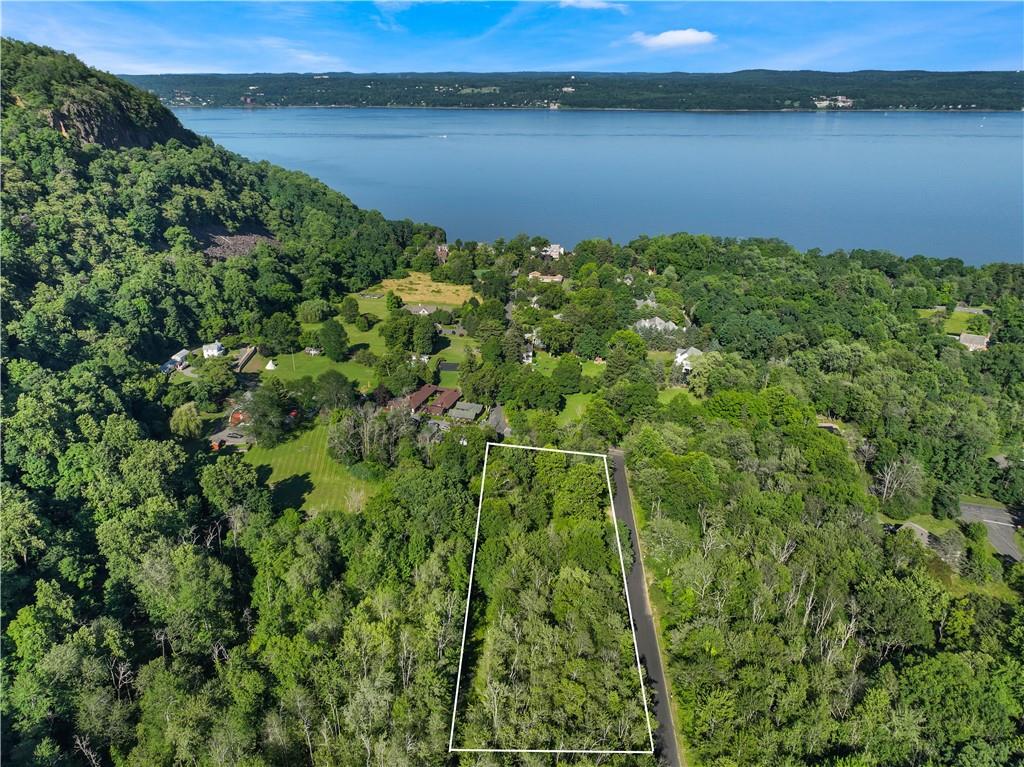 a view of a lake with green field