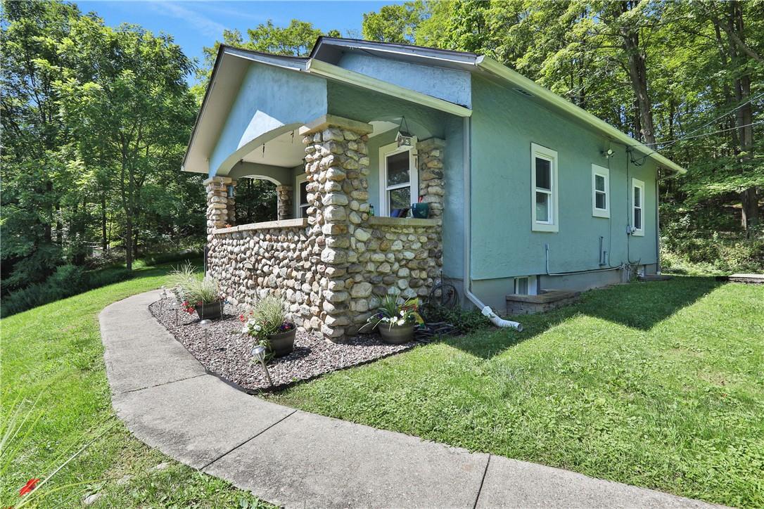 View of home's exterior featuring a yard