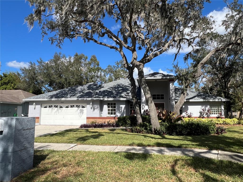 a view of a house with a yard