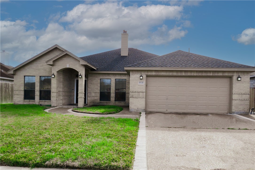 front view of a house with a yard