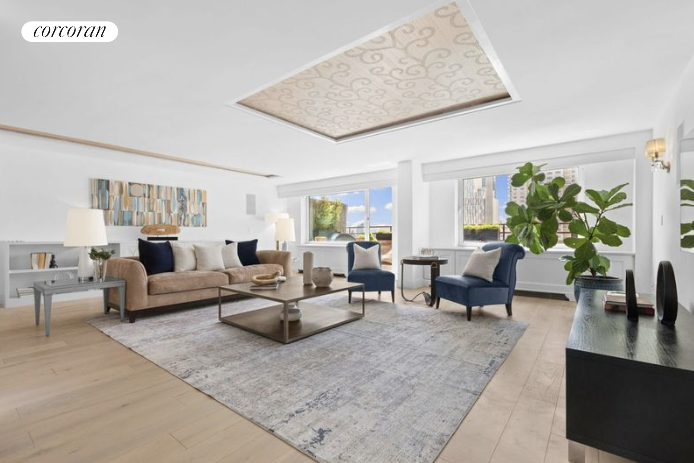 a living room with furniture and a potted plant