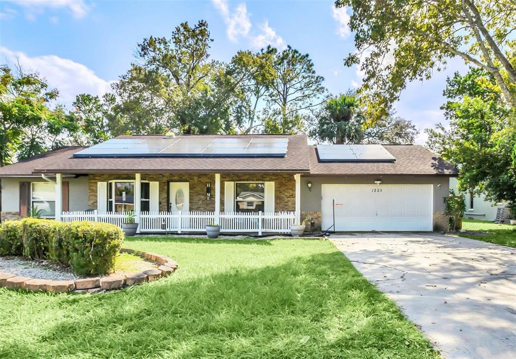 front view of a house with a yard