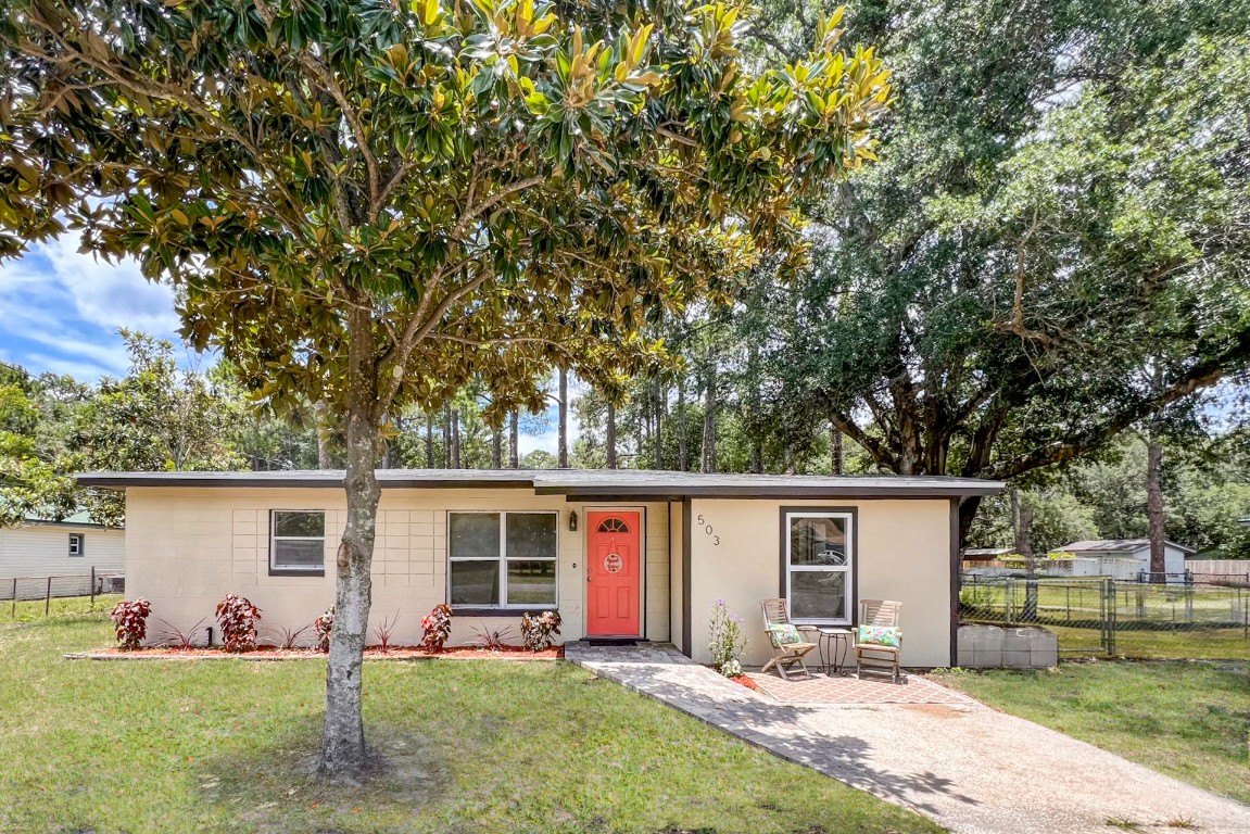 front view of a house with a yard