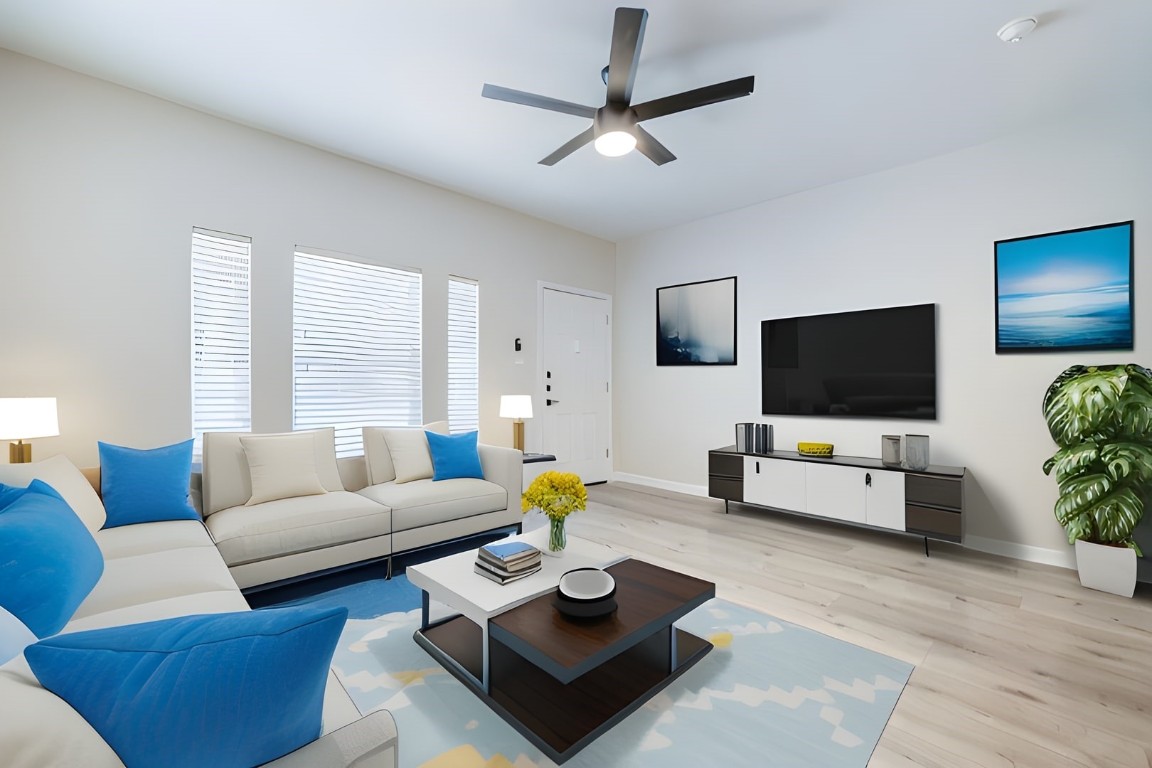 a living room with furniture and a flat screen tv