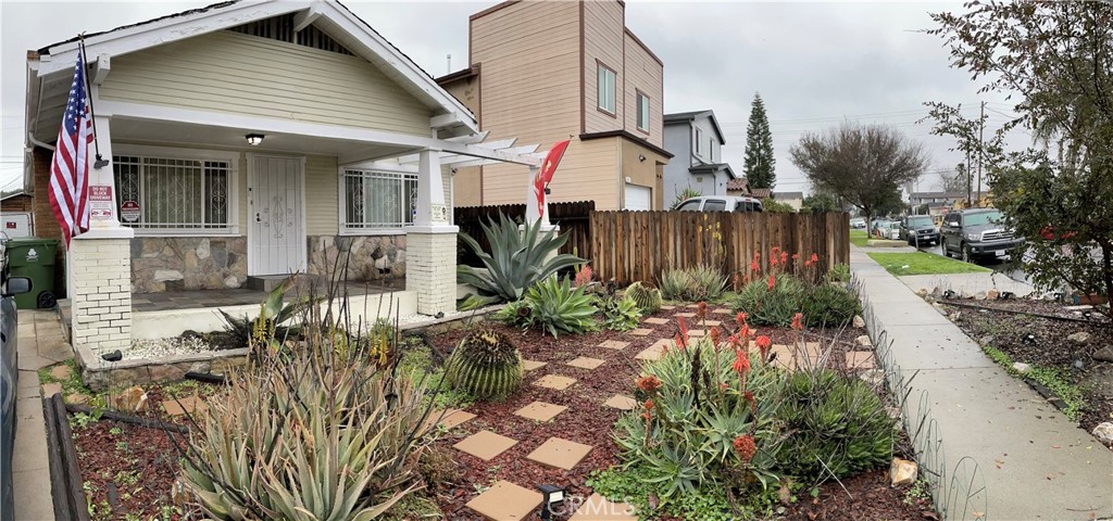 a view of a house with a flower garden