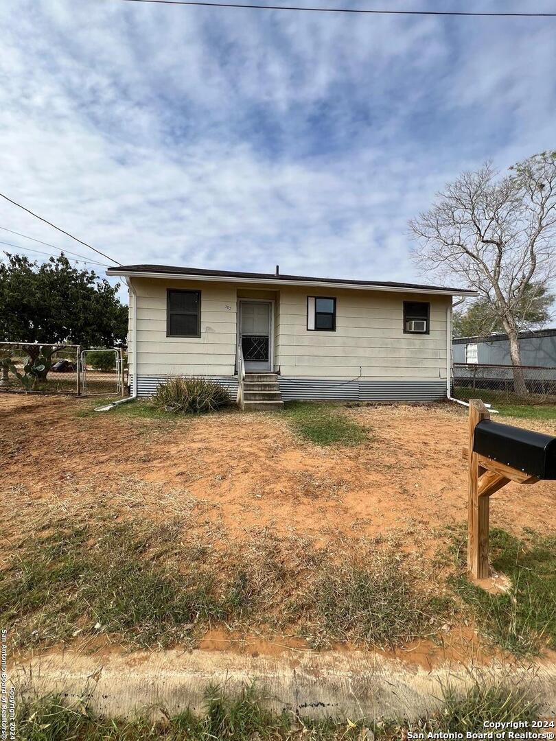 a front view of house with yard