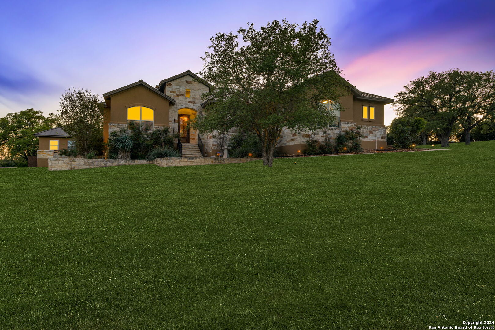 a front view of a house with garden