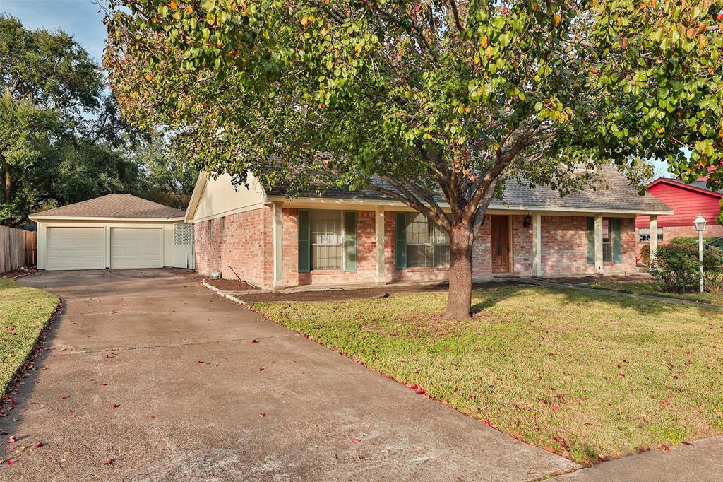 a house with trees in the background