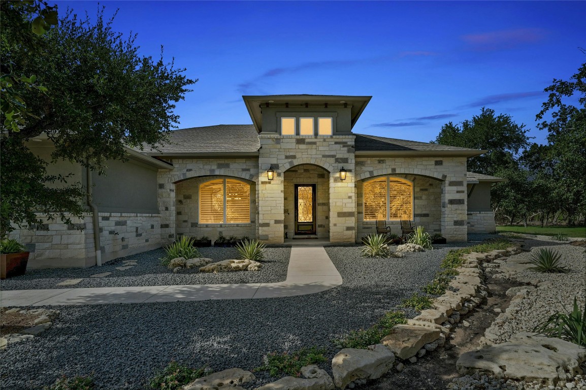 a front view of a house with garden