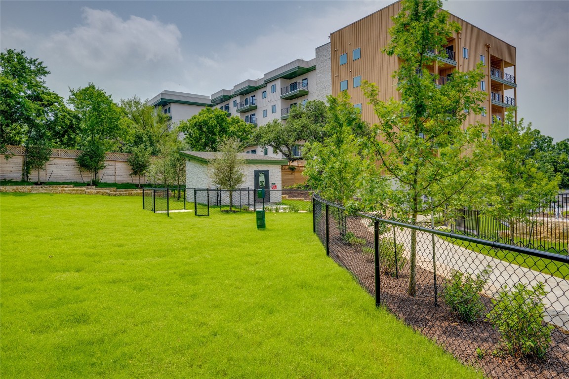 a view of a swimming pool with a patio and a garden