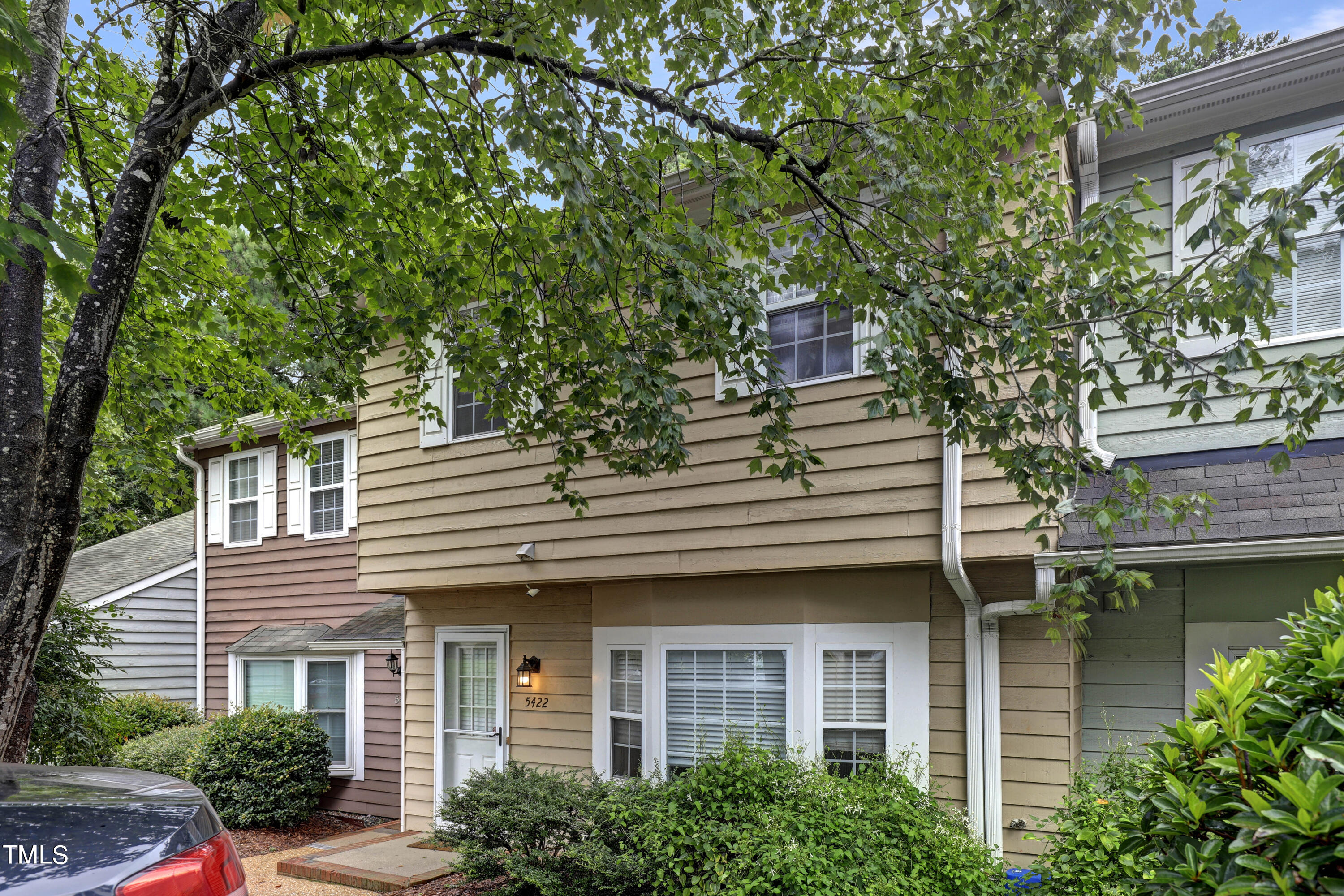 a view of a house with a tree