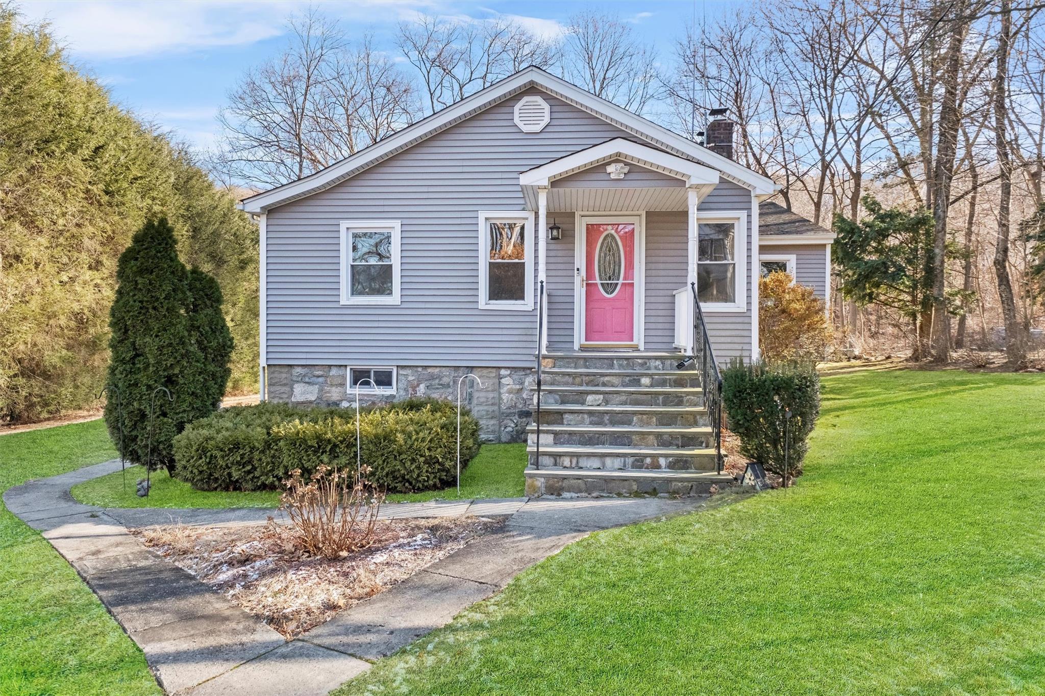 Bungalow-style home featuring a front yard