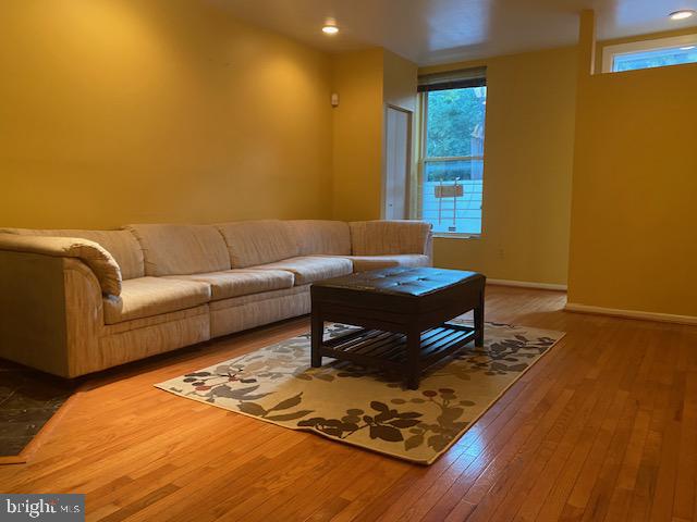 a living room with a couch and a rug