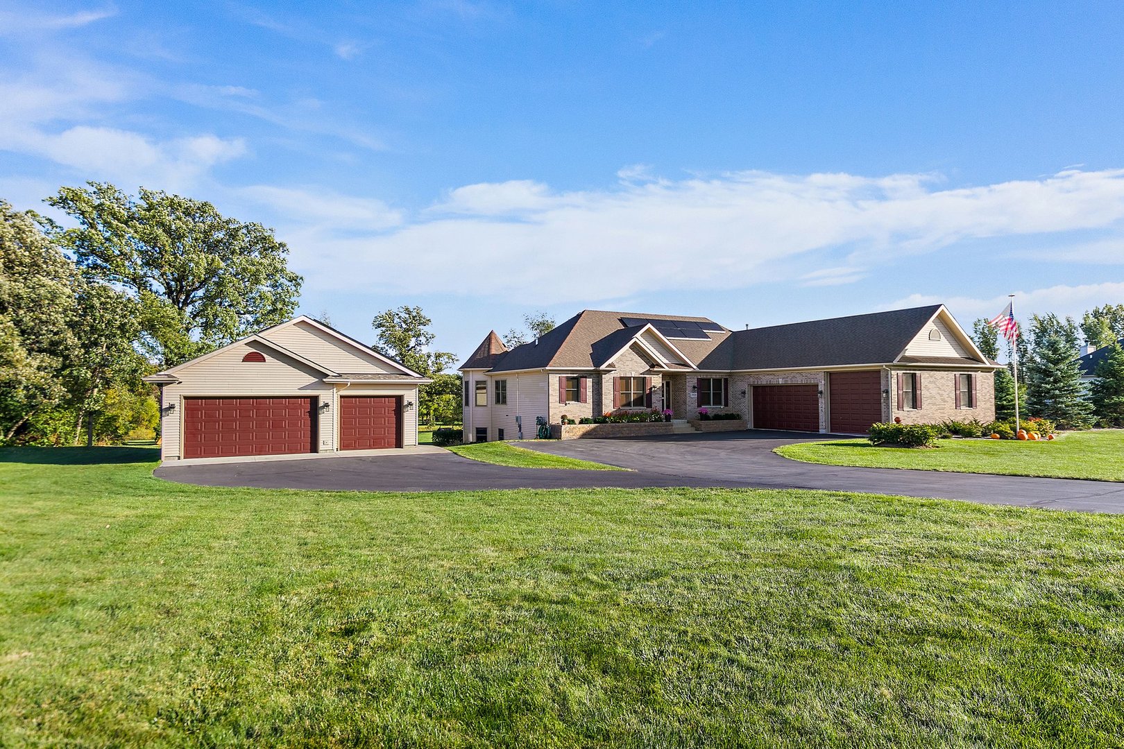 a front view of house with yard and green space