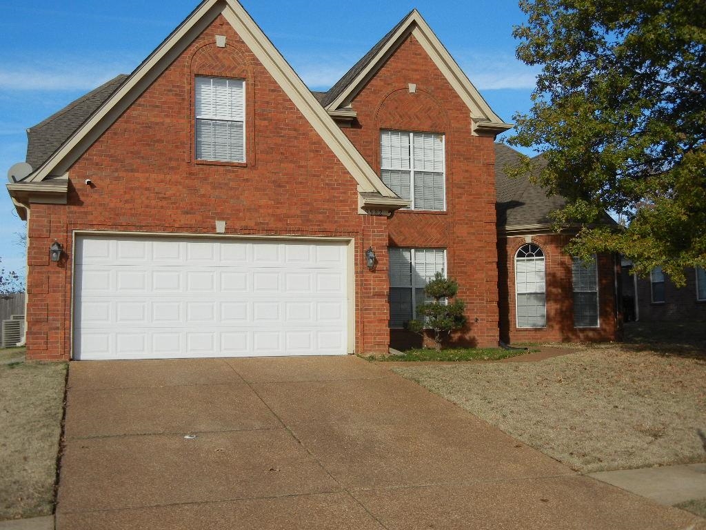 View of front property featuring a garage