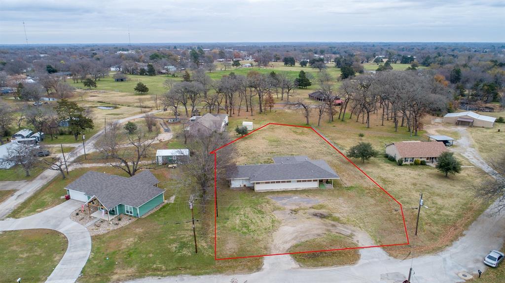 an aerial view of a house with outdoor space