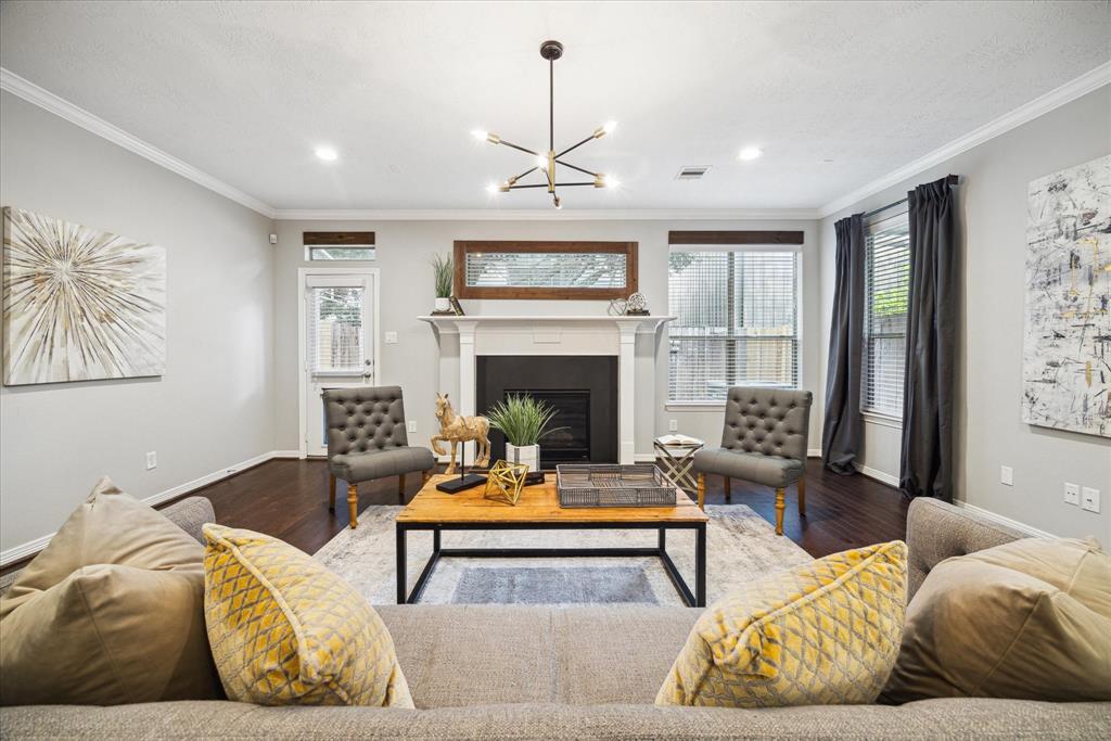 Step into the spacious living room, featuring a grand fireplace as its centerpiece. This inviting space combines comfort and elegance, offering the perfect setting for relaxation and gatherings.