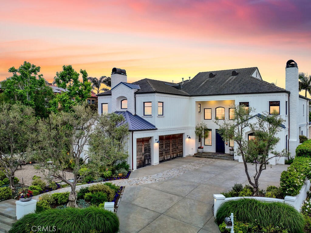 Estate living awaits you! Custom landscape and hardscape designed with every detail addressed to perfection. Gorgeous custom reclaimed wood garage doors, casement windows throughout. Beautiful patina on the copper chimney toppers and rain gutters are just a few of the noticeable details as you arrive.