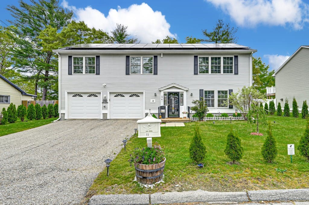 a front view of a house with a yard