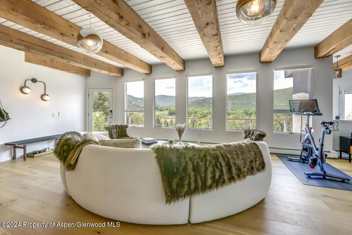 a living room with furniture and a large window