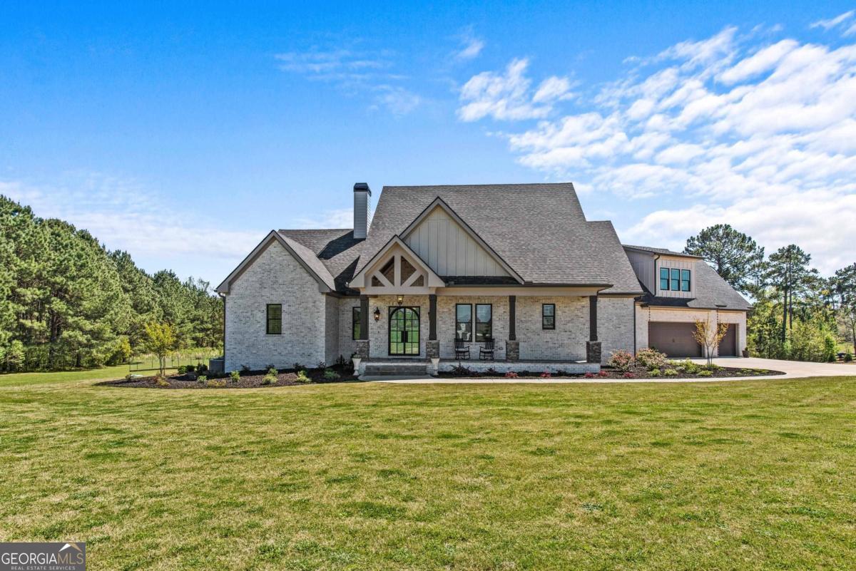 a front view of a house with a yard