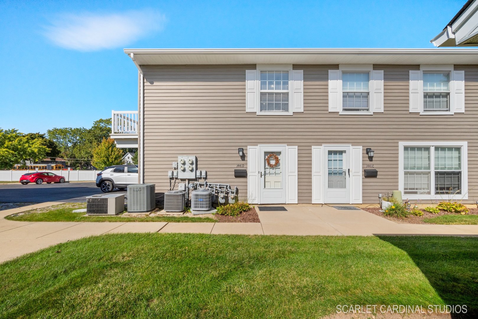 a front view of house with outdoor seating and yard