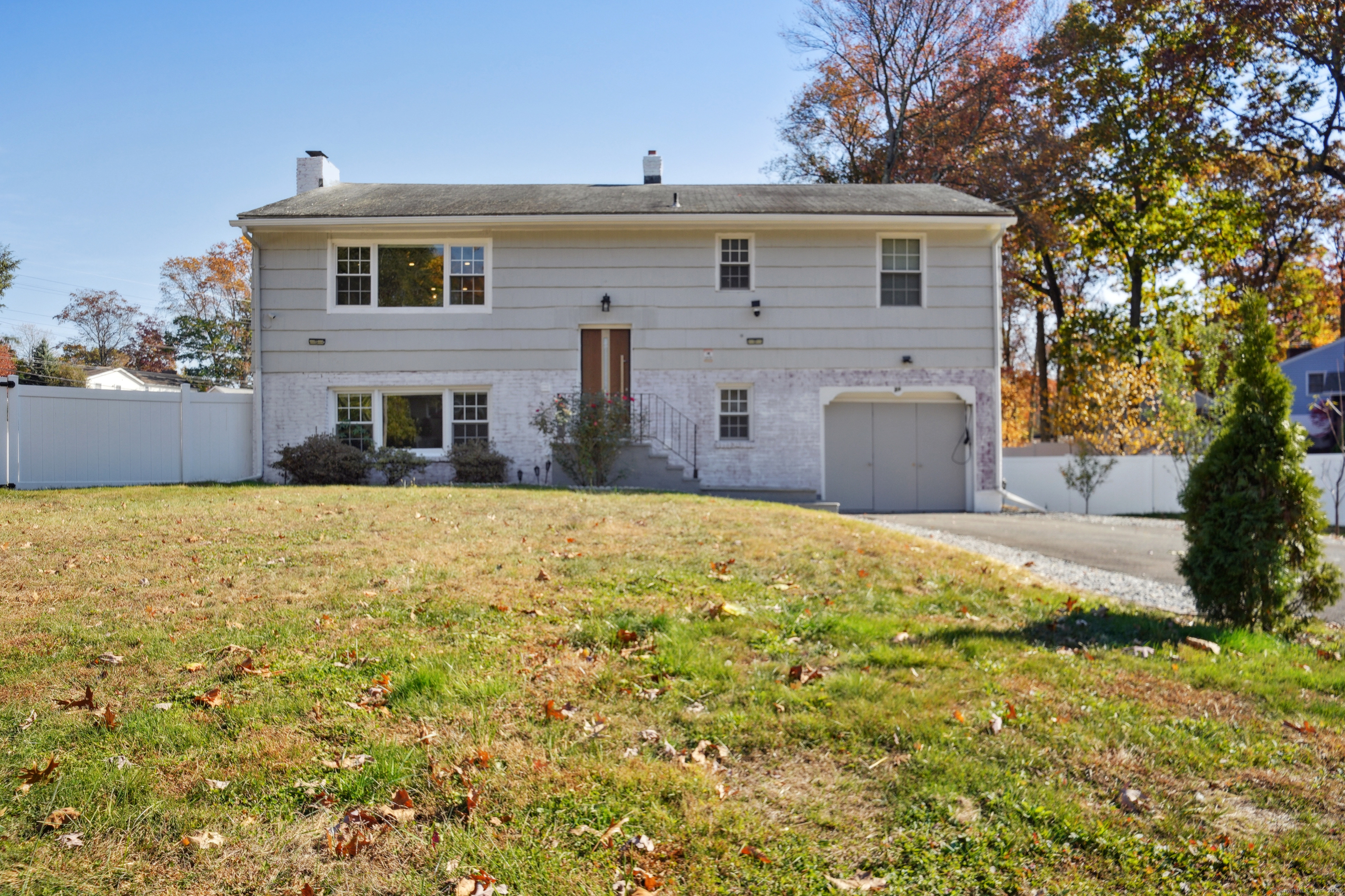 a front view of a house with a yard