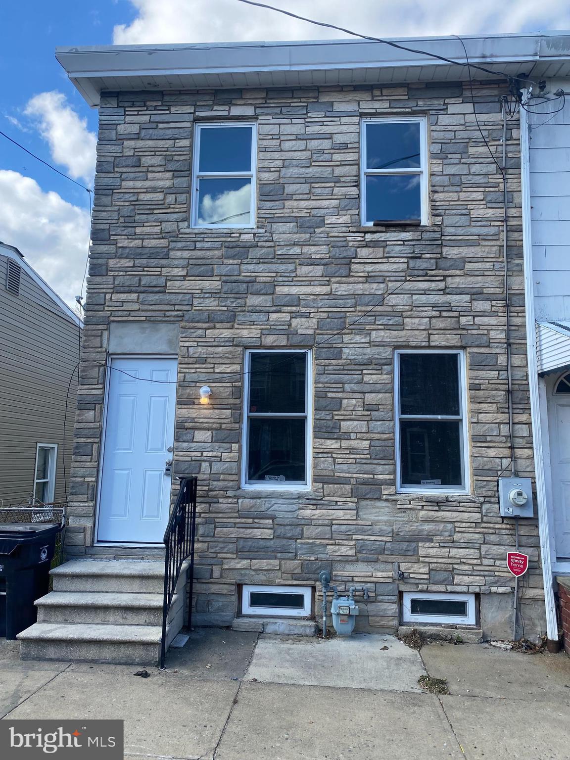 a brick house with four windows