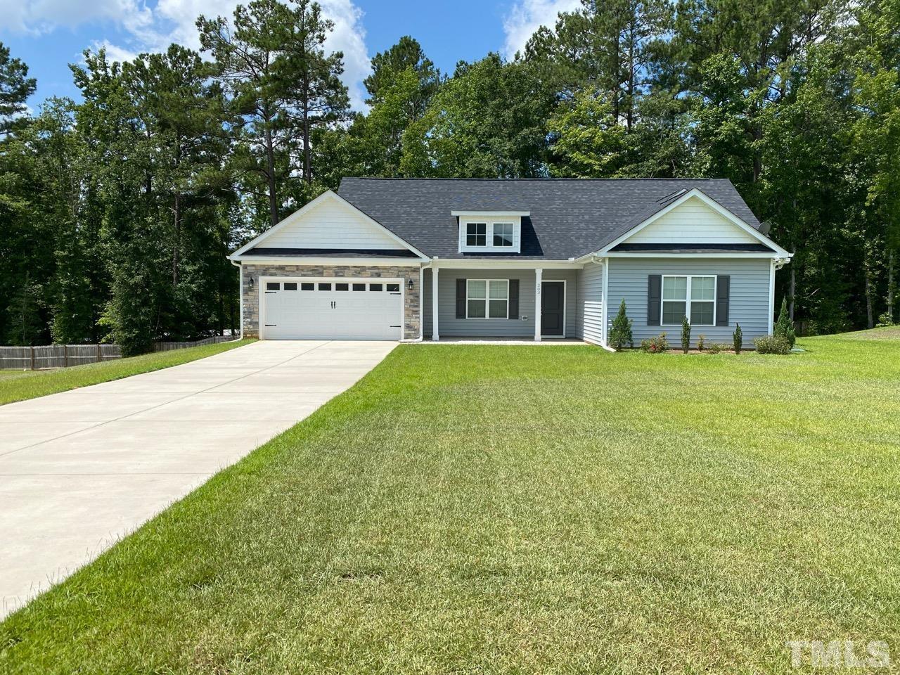 a house with garden in front of it