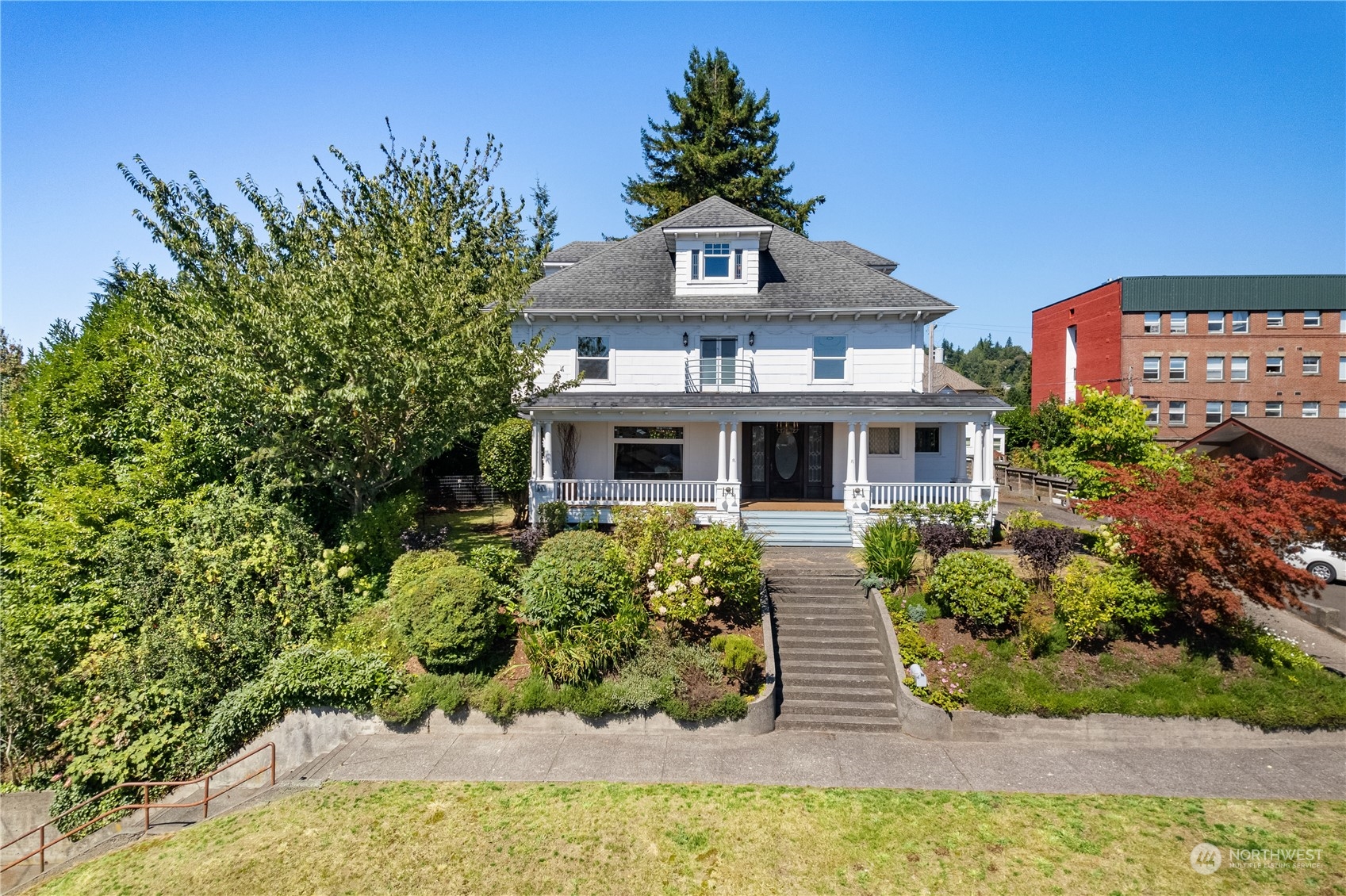 a front view of a house with a yard