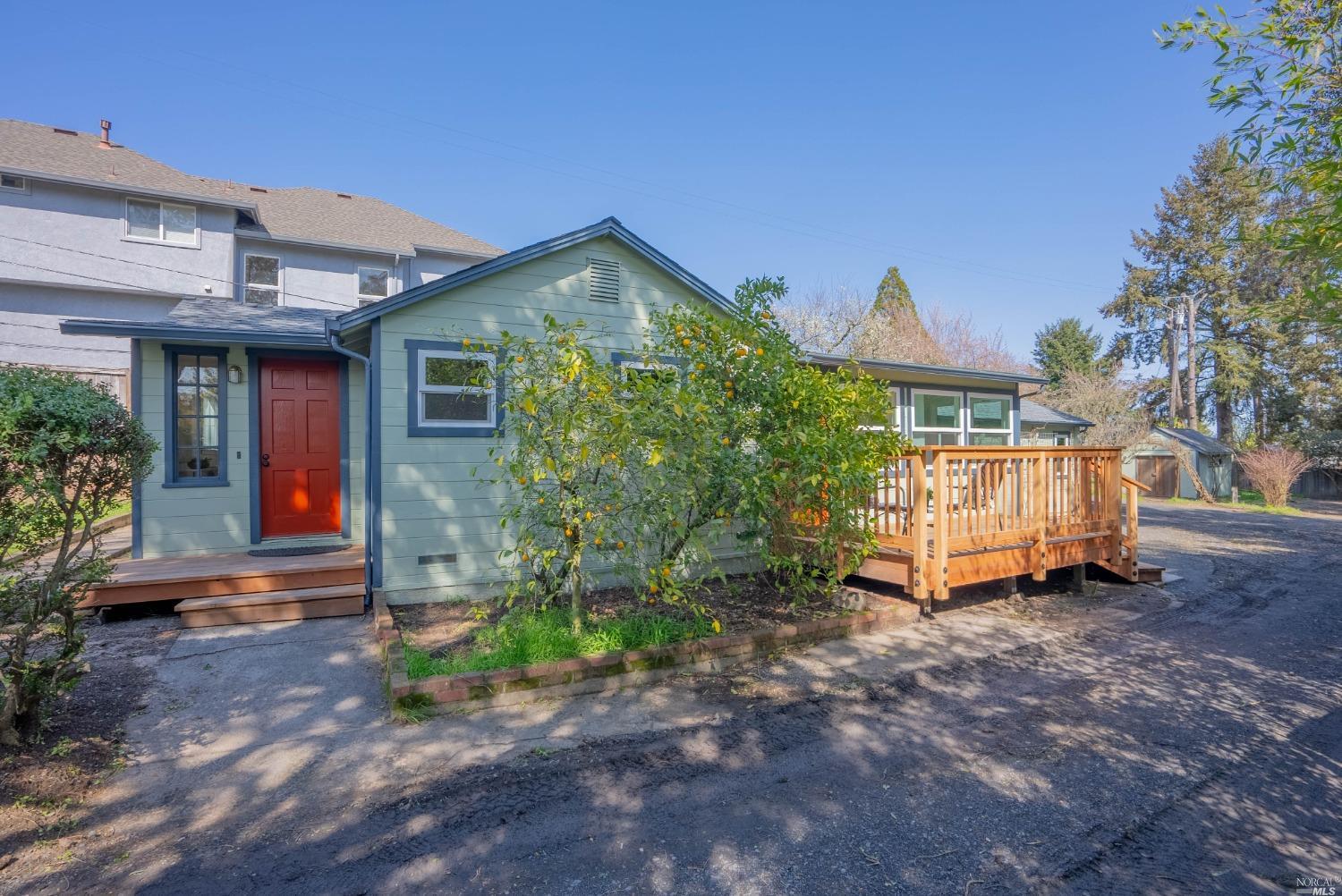 a view of a house with a yard and plants