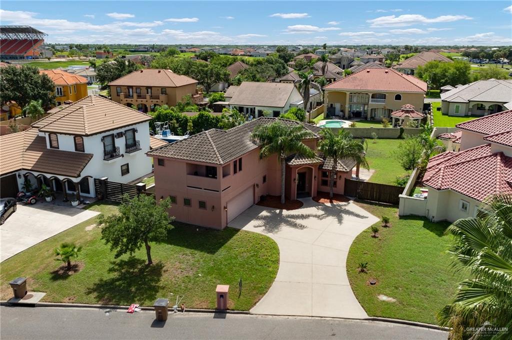 an aerial view of multiple houses with a yard