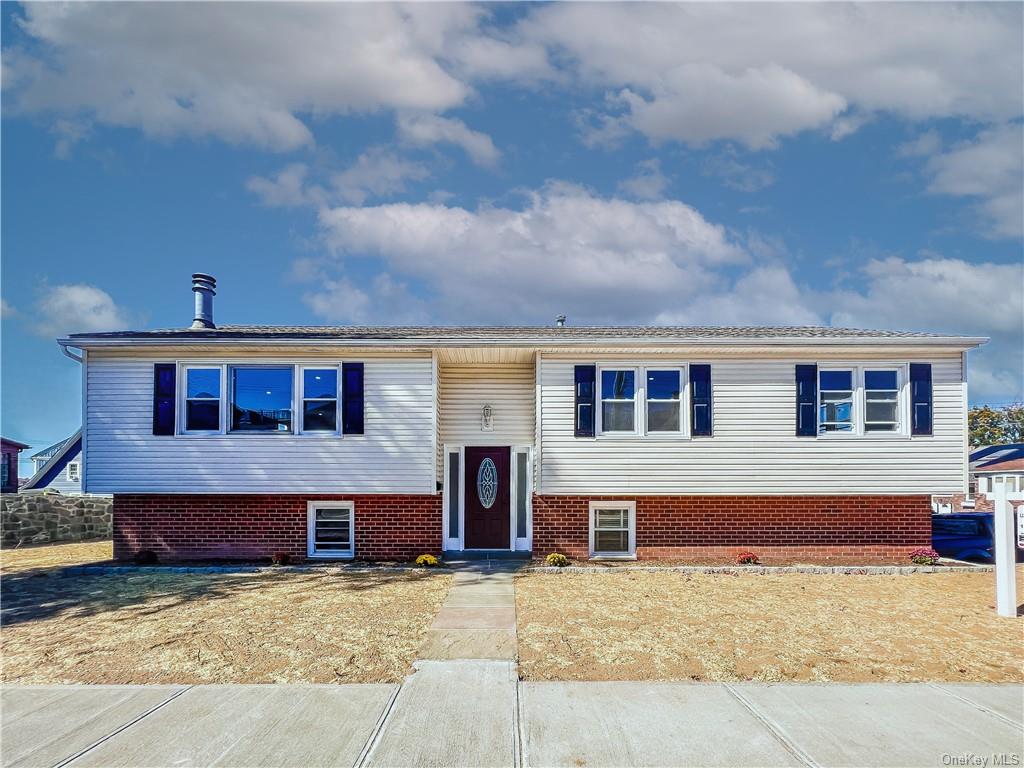 a front view of house with yard outdoor seating and barbeque oven