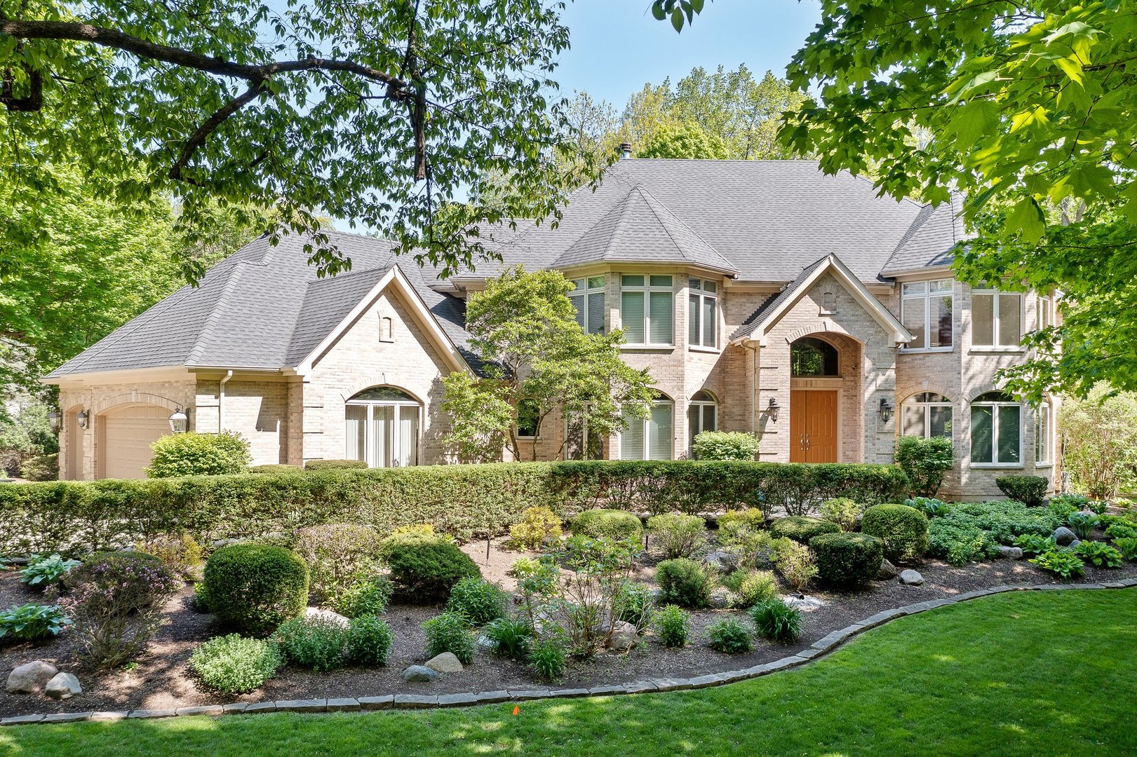 a front view of a house with a yard