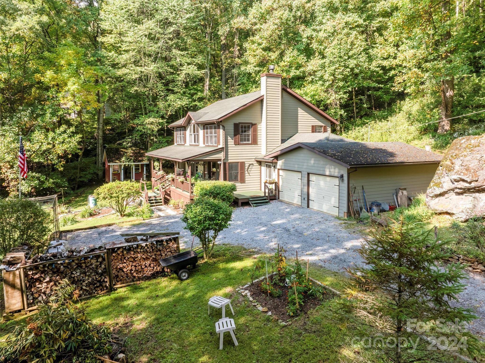 a front view of a house with a yard and porch