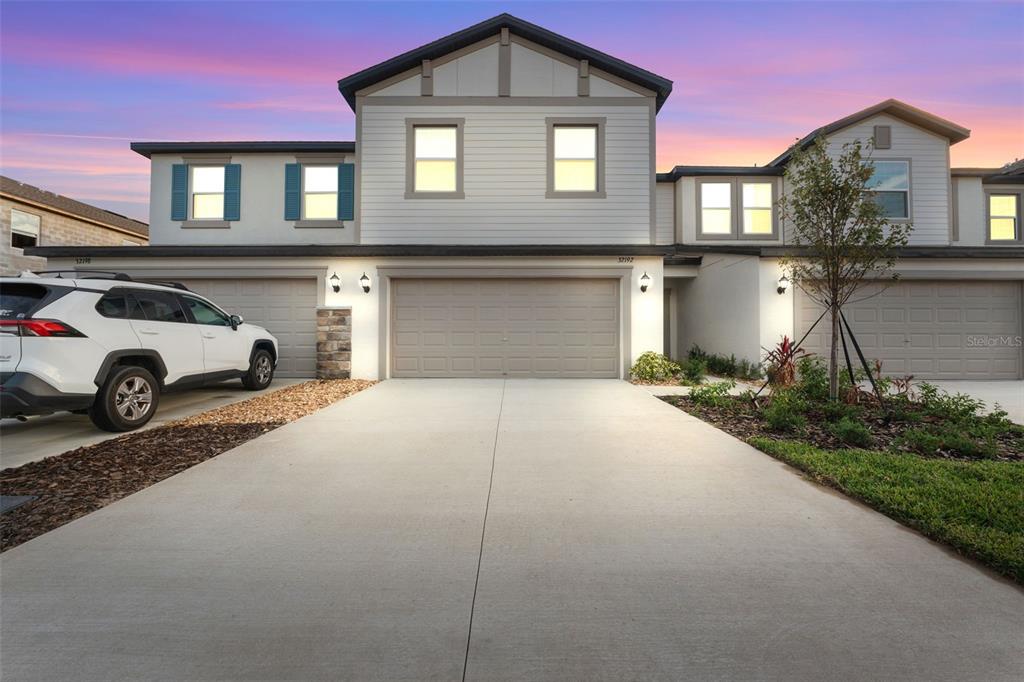 a front view of a house with parking