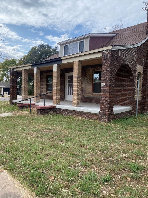 a front view of a house with garden